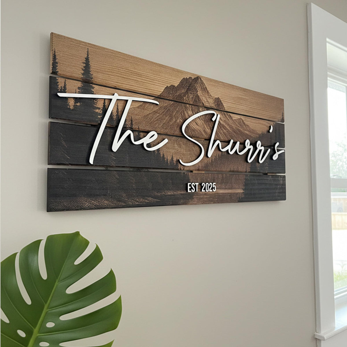 Custom last name sign with layered mountain ridge design on wood