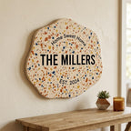 Personalized family name wood sign with terrazzo speckled texture and raised 3D lettering